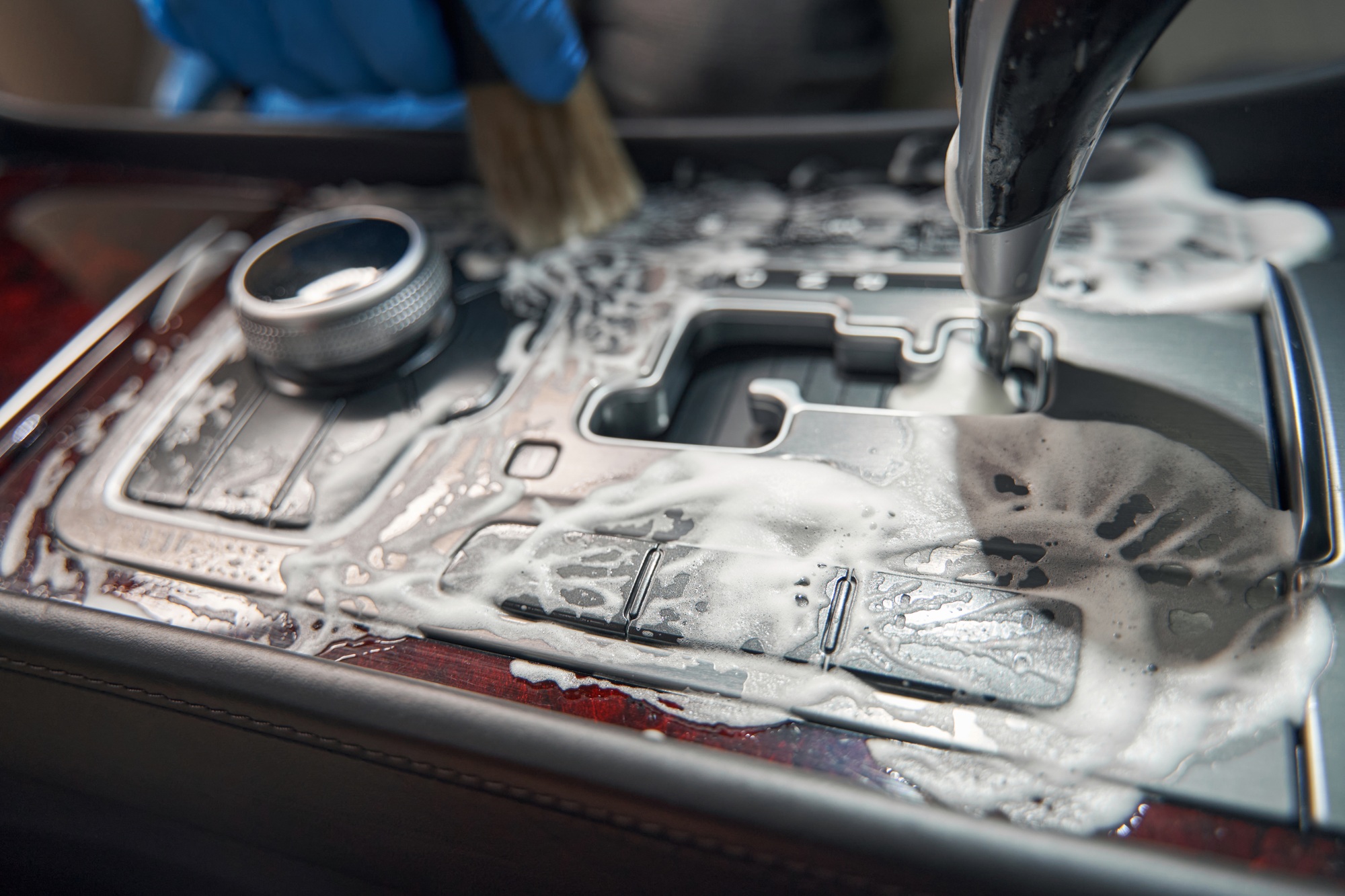 Photo of detailing car interior by foam detergent